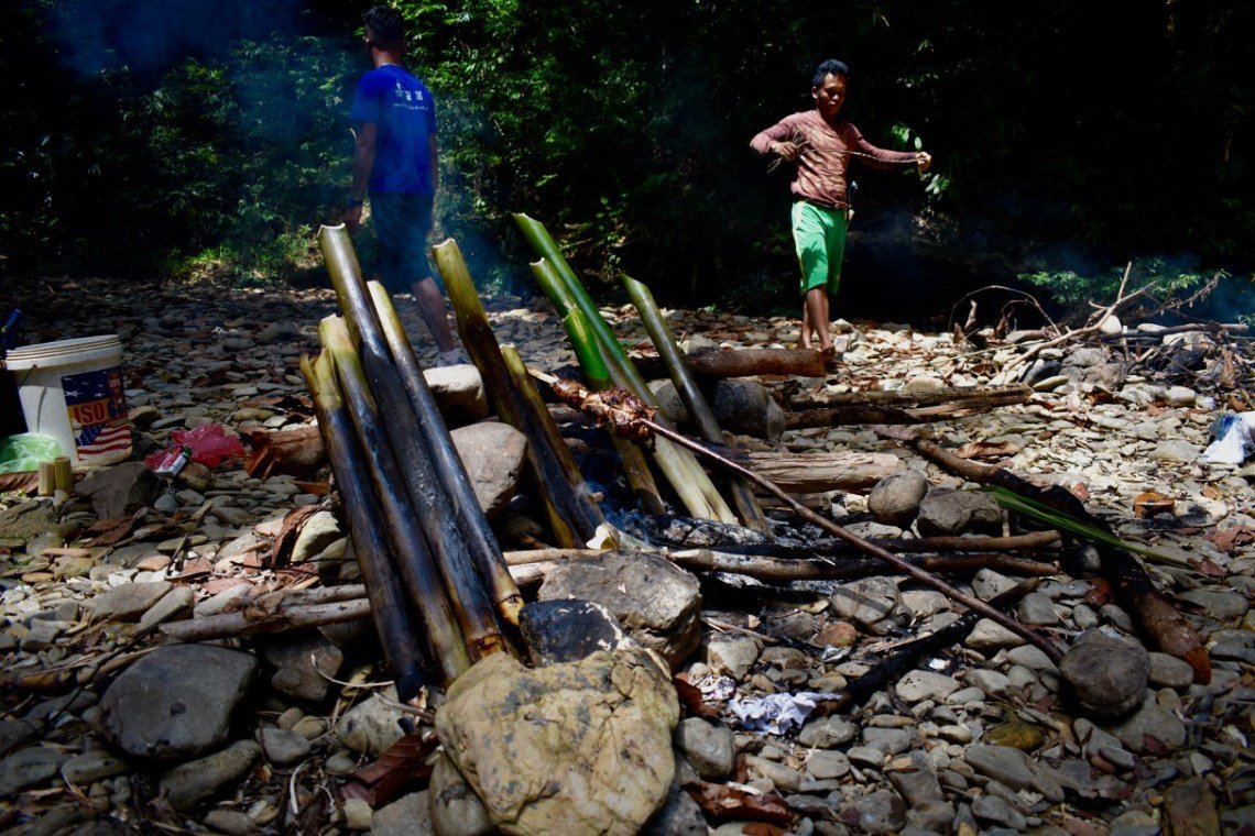 bamboo cooking by the river iban longhouse borneo